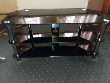 Photo of free Black glass TV stand (Harringay N4) #1