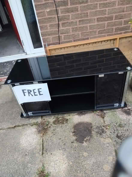 Photo of free Large Glass TV unit (Scale Hall LA1) #1