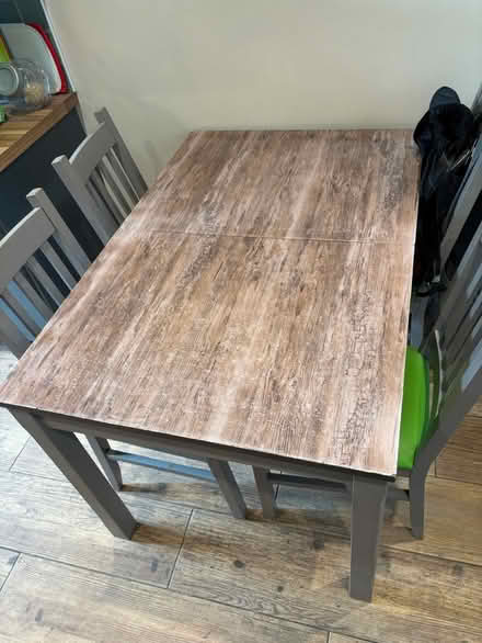 Photo of free Wooden table. Extending four chairs (Prestwich M25) #1