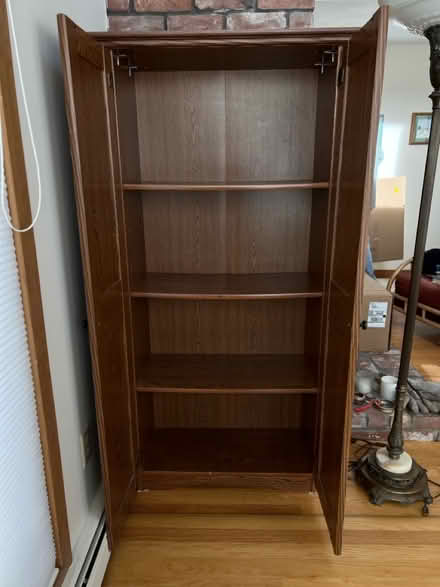 Photo of free Tall wood cabinet (Groton near Shaw’s) #1