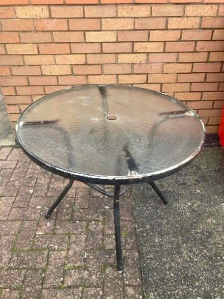 Photo of free Outside Glass Patio Table (Fenton Industrial Estate ST4) #1