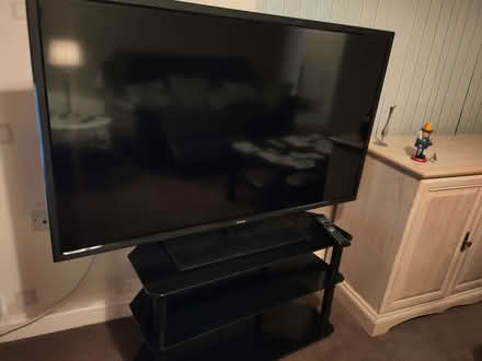 Photo of free TV and stand in good working order think it's a 52 inch (Hillmorton CV21) #1