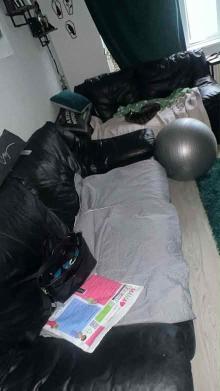 Photo of free Black leather sofa (Goldington MK41) #1