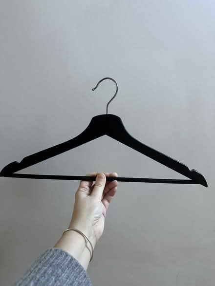 Photo of free Approx 50-ish black wooden hangers (Charlton SE18) #1