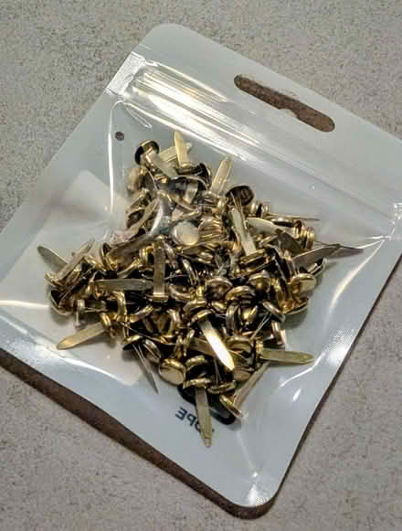 Photo of free Gold finish paper fasteners (St Albans AL1) #1