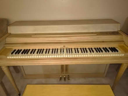 Photo of free Piano and bench with books (South Lorain) #2