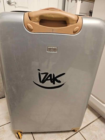 Photo of free Large checked suitcase (Raritan Township/Ringoes) #2