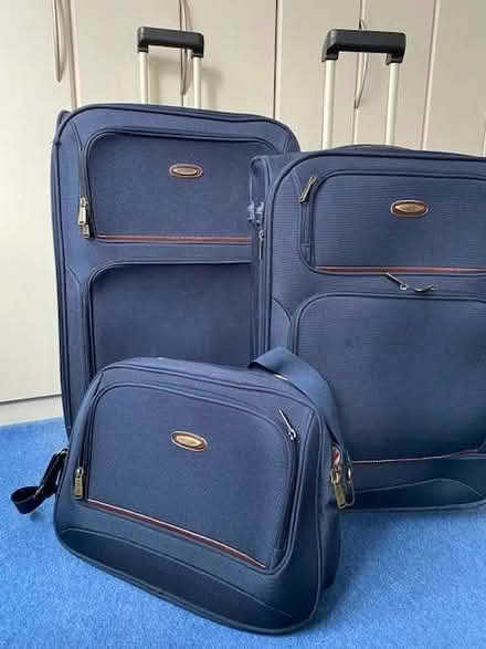 Photo of free Set of blue suitcases and bag (GU14) #1