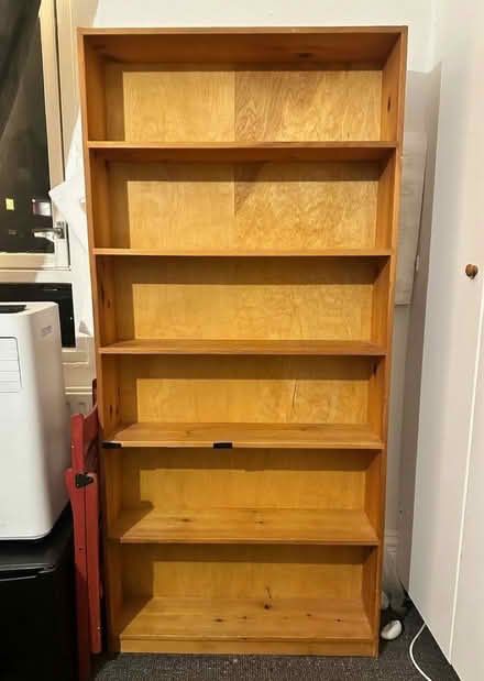 Photo of free Tall wood shelves (Sw9 near Stockwell station) #1