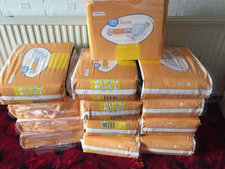 Photo of free 13 new packets of incontinent pads (Heald Green SK8) #1