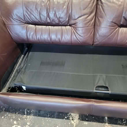 Photo of free 2 leather sofas /1 is a double sofa bed and a foot stall (Rayleigh SS6) #1