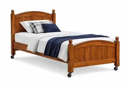 Photo of free Wood bed on wheels (76102) #1