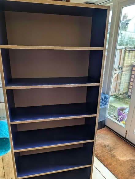 Photo of free Navy blue and light wood bookcase (Hertford SG13) #1