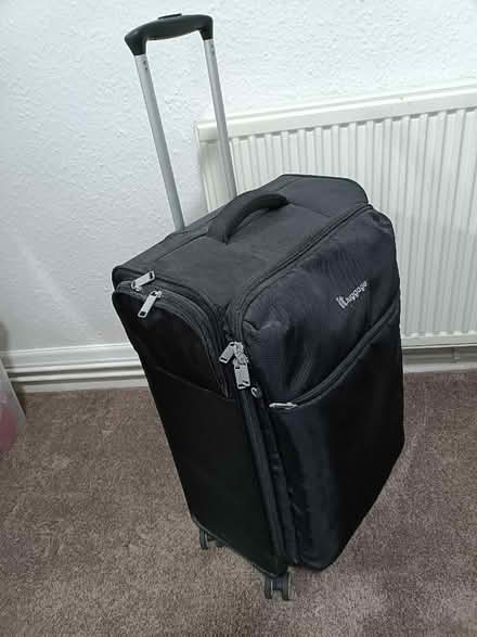 Photo of free Black suitcase, with 4 double wheels, extending handle (St Michaels TQ3) #2