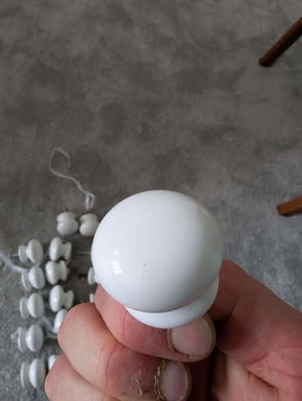 Photo of free 22 white cupboard/draw knobs (Burnmill Farm LE16) #2