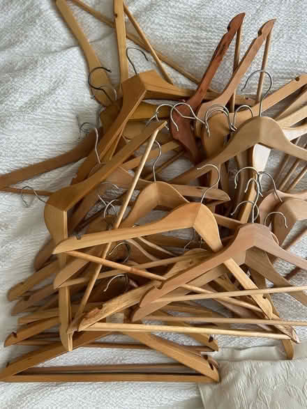 Photo of free 30 wooden hangers plus some plastic and metal (NW10) #1