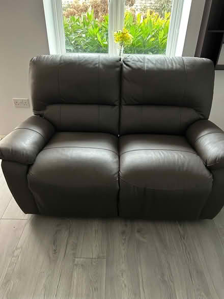 Photo of free Two seater brown leather reclining sofa plus footstool (Benslow SG4) #1