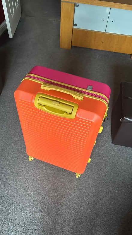 Photo of free Large pink orange suitcase, hard body (Sandhurst GU47) #1