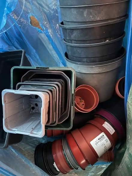 Photo of free Large bag of assorted plastic plant pots (Montague Street area NN16) #1