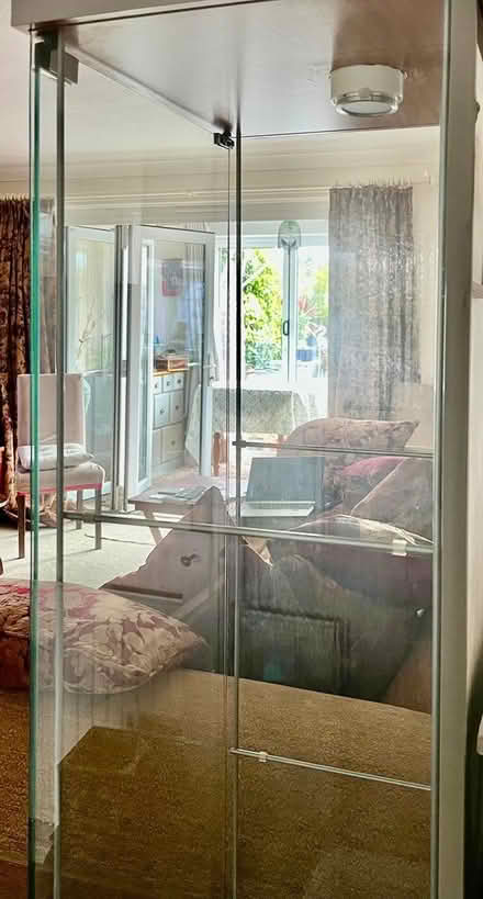 Photo of free Glass and mirror tall display unit (Willingdon Trees) #1