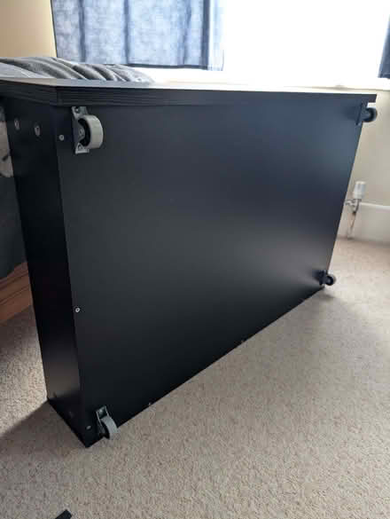 Photo of free Black wooden drawer on wheels for underbed storage (Ikea) (Headington OX3) #2