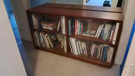 Photo of free Wood and glass bookshelf (GU22 Park Road Woking) #1