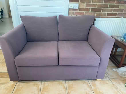 Photo of free Brown two seater sofa bed. (Acle NR13) #1