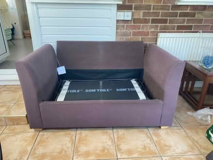 Photo of free Brown two seater sofa bed. (Acle NR13) #2