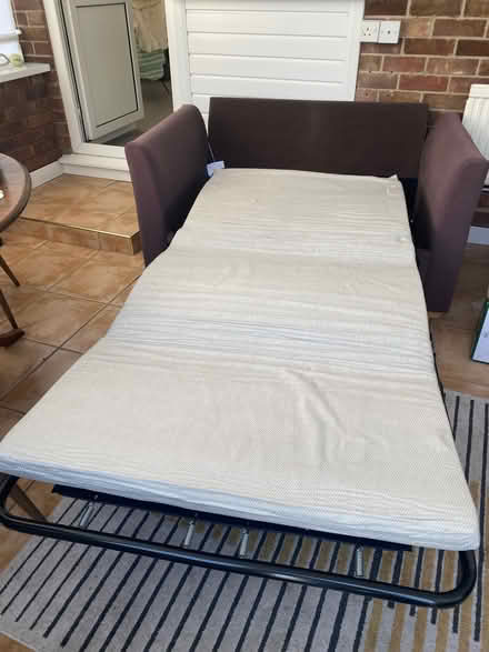 Photo of free Brown two seater sofa bed. (Acle NR13) #3