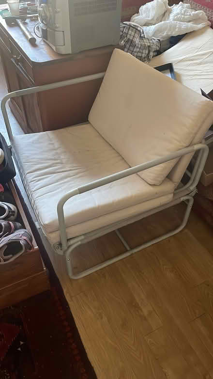 Photo of free Cream single futon chair/bed. Makes a good handy single bed (Freehold LA1) #1