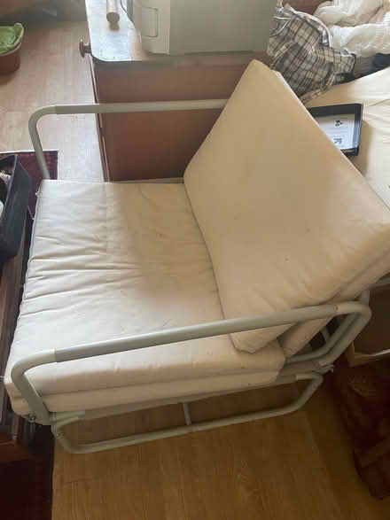 Photo of free Cream single futon chair/bed. Makes a good handy single bed (Freehold LA1) #2