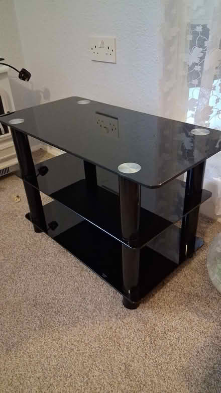 Photo of free Black glass TV stand see photo (West Horsham) #1
