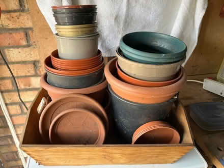 Photo of free A wooden trug and a variety of used plastic flower pots. (Bridgewood Gate ME5) #1