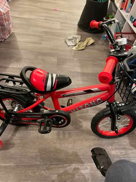 Photo of free Red bike with stabilisers (Wandsworth SW18) #1