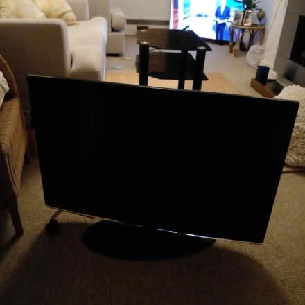 Photo of free Tv and table stand (East Manchester) #1