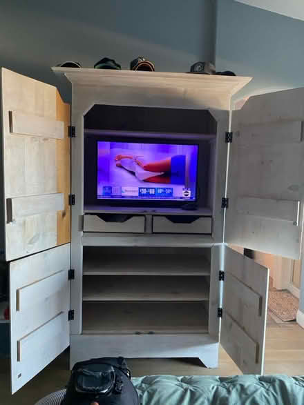Photo of free Tall wood cabinet (tv not included) (5 canyons Castro Valley) #1