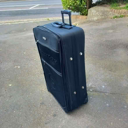 Photo of free Extra-large suitcase (Hastings TN34) #1