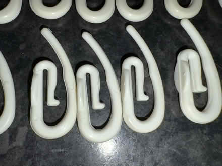 Photo of free 21 clean white plastic curtain hooks (Tolworth KT6) #2