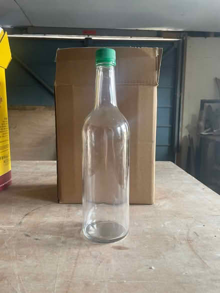 Photo of free Clear glass lidded bottles x 16 (Presteigne LD8) #1