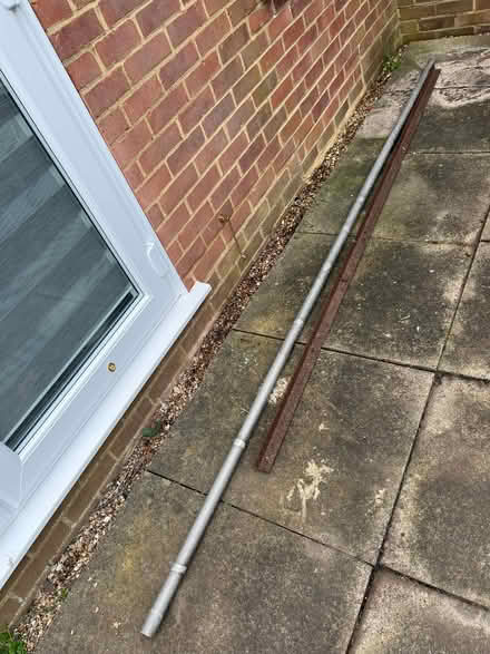 Photo of free Two long metal poles (College Town GU47) #1