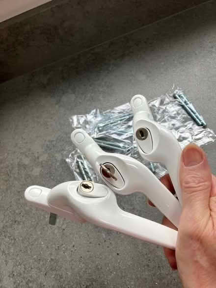 Photo of free 3 white upvc window handles + 7 x packs of pairs of screws (Cheadle Hulme SK8) #3