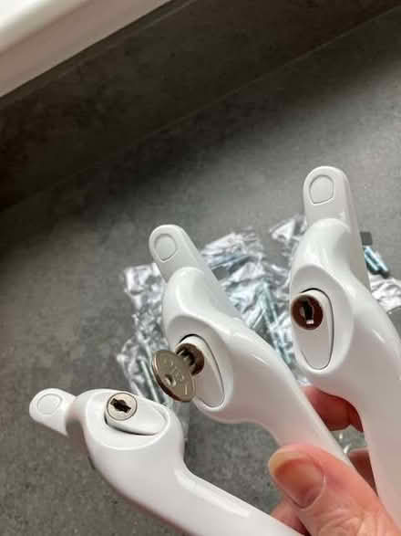 Photo of free 3 white upvc window handles + 7 x packs of pairs of screws (Cheadle Hulme SK8) #2