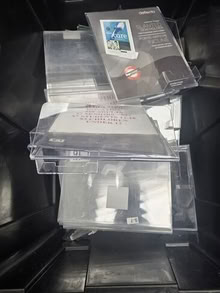 Photo of free bin full of small acrylic sign holders #2