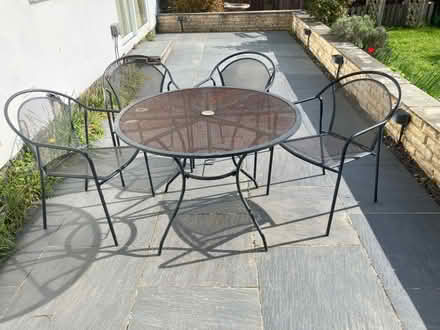 Photo of free A metal patio table and 4 matching chairs (Little Herberts GL53) #1