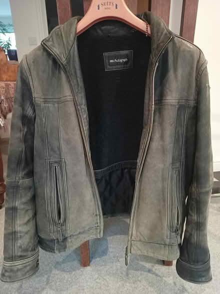 Photo of free Old black leather jacket. Well worn (Godalming GU7) #1