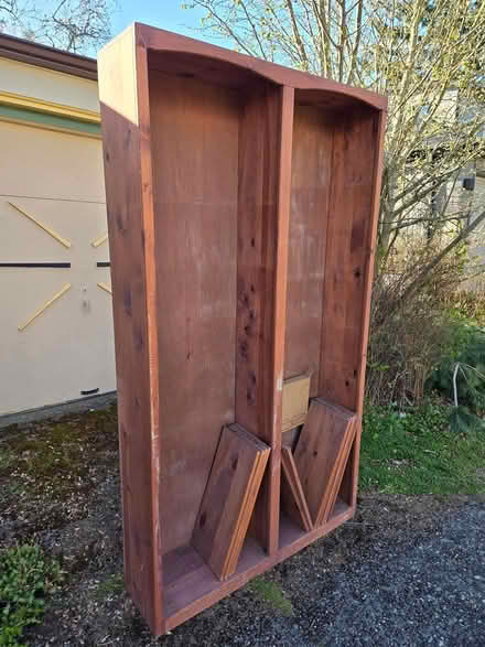 Photo of free Tall wood bookshelf (West Seattle) #1