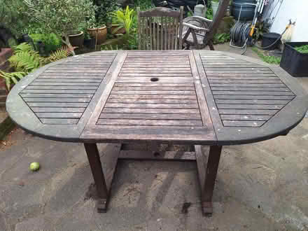 Photo of free Large teak garden table & 4 chairs (Hurst RG10) #1