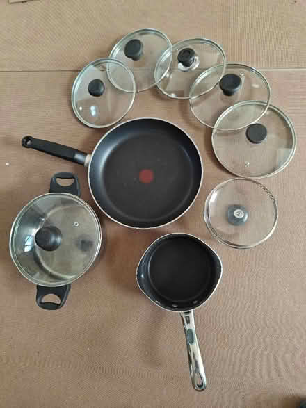 Photo of free Saucepans, Tefal frying pan and random lidsand (Woking GU22) #1