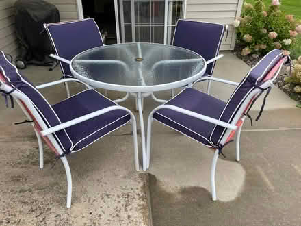 Photo of free 36" glass top patio table set (NE Rochester, MN) #1