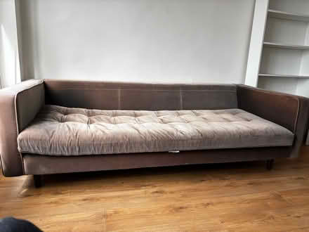 Photo of free Brown solid three seater sofa - missing cushions (Millbank SW1P) #1